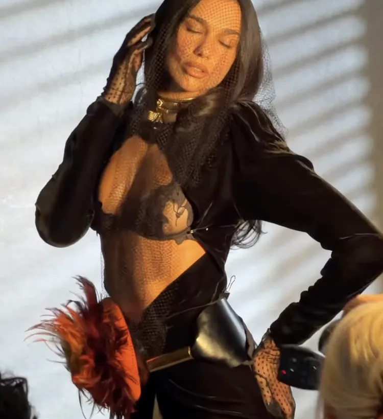 Dua Lipa posing in a photoshoot for Vogue Italia.