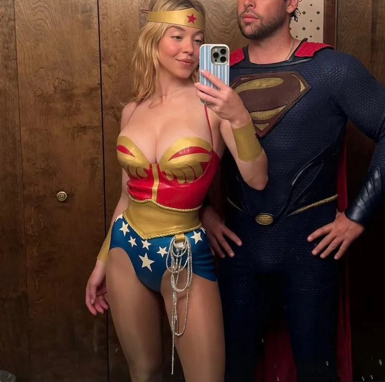 Sydney Sweeney mirror selfie in red Wonder Woman latex corset with Scooter Braun as Superman
