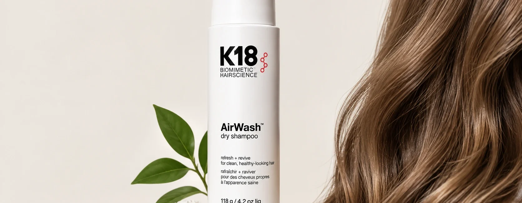 K18 dry shampoo AirWash bottle on a neutral background